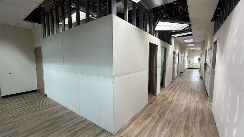 Office corridor with newly built partition walls and flooring
