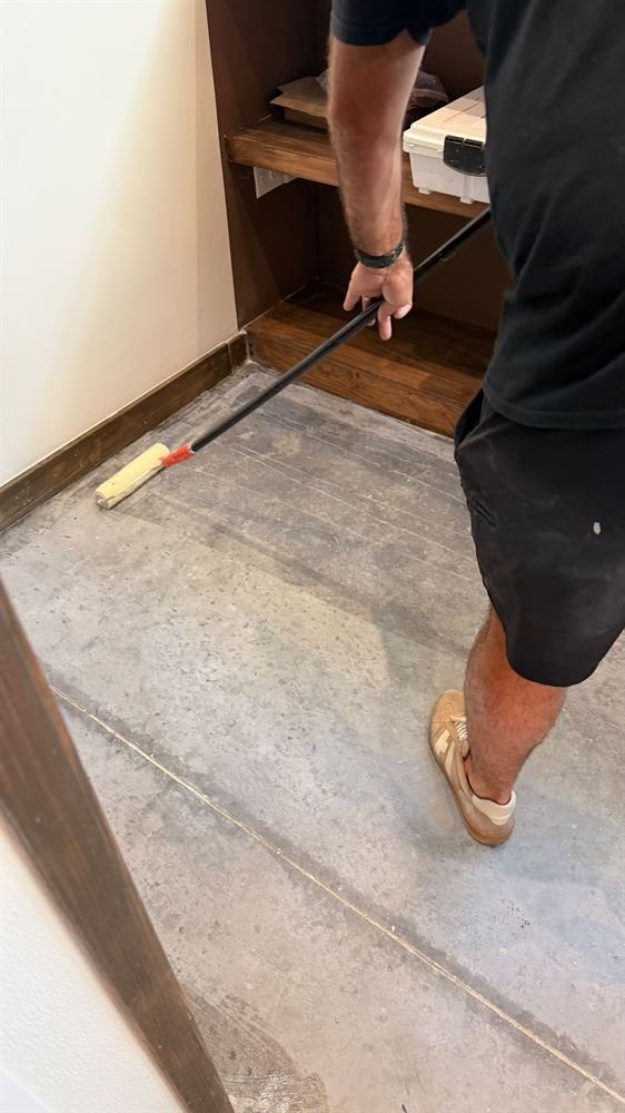 Floor being leveled and prepped before new flooring installation