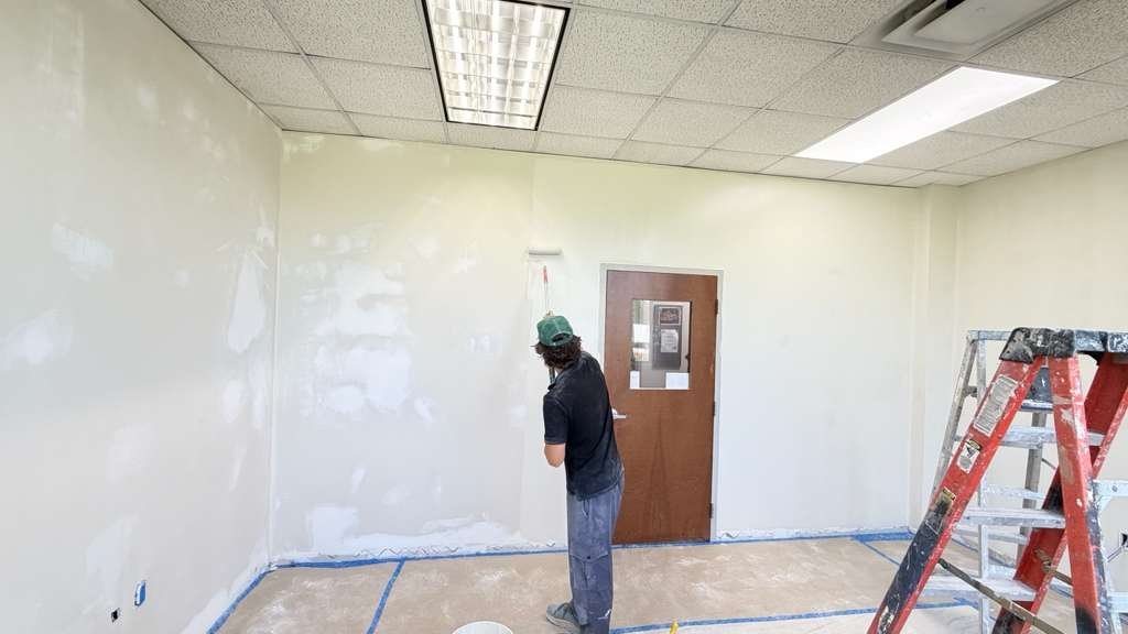Right Home USA team painting an interior wall